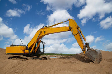 Excavator. The excavator is working on loading sand. Special equipment is used for construction.