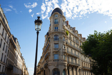 The facade of traditional French house with typical balconies and windows. Paris. - 624113409
