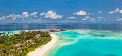 Fototapeta na wymiar Maldives paradise island. Tropical aerial landscape, seascape pier, water bungalows villas amazing sea lagoon beach. Exotic tourism destination, summer vacation. Beautiful nature, palm trees sea sky