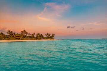 Fantastic closeup calm sea waves, sand with colorful sunrise sunset light sky. Tropical island...