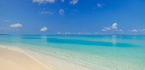 Beautiful beach background. Tropical panoramic beach view and blue sea waves blue sky and fluffy clouds. Summer coast, Mediterranean sandy seascape. Relax peaceful landscape. Tranquility, idyllic