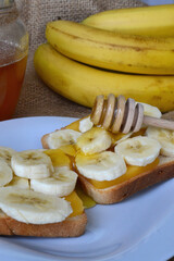a stick with honey lies on the sandwiches