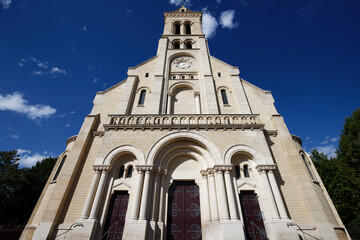 Fototapeta na wymiar Main facade of the Notre-Dame-du-Rosaire Church, in Saint-Ouen, France .