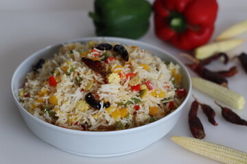 Chilly garlic vegetable rice. Mildly spiced garlic flavored basmati rice with sauteed bell pepper and baby corn
