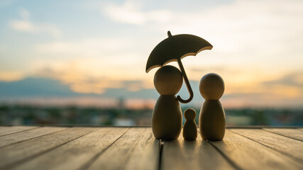 umbrella icon and family model, Security protection and health insurance. The concept of family...