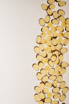 Vitamin pills yellow small backlight top view copy space macro