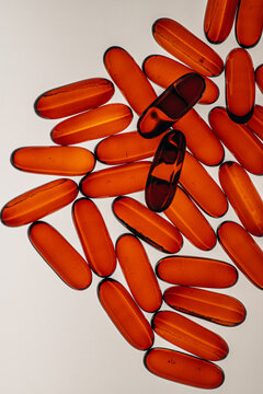 Medicine vitamins clearance fish oil pills on white background top view macro 