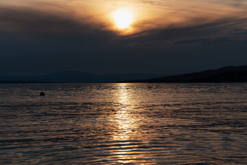 Atmospheric sunset over the Croatian Adriatic coast in early summer.