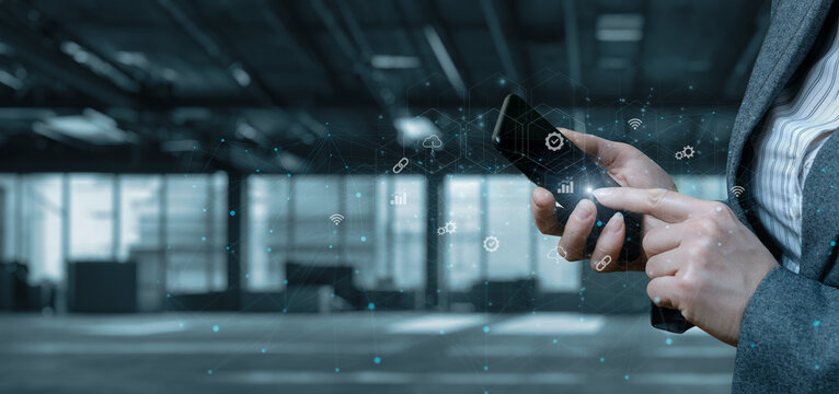 Businesswoman working on a mobile device with the interface.