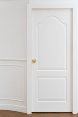 gold door knob handle. reflective surface and modern design add touch of luxury to entrance door. Crafted with metal and wood, this round knob shines with style and security.