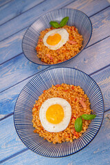 RECIPE FOR BLE WITH BACON, TOMATO AND SHALLOTS, SERVED WITH FRIED EGG. High quality photo