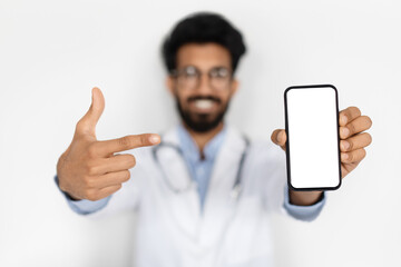 Smartphone with white empty screen in doctor hand