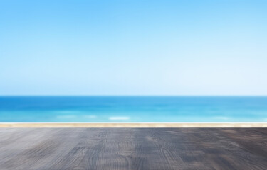 Black Wooden floor with sea and blue sky background, for product display. High quality photo