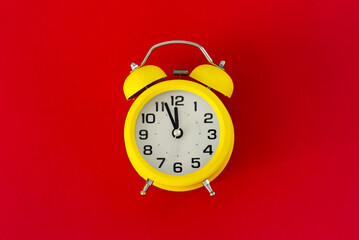 Yellow  classic desktop clock the red  background
