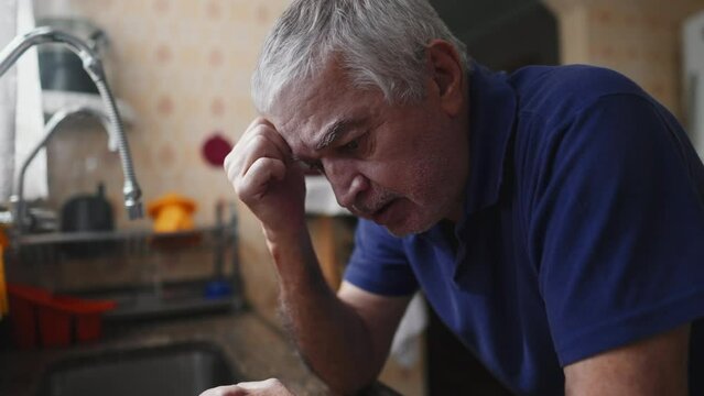 Elderly Man Struggling with Illness at Home, Defeat and Desperation in Dramatic Scene, senior person facing quiet despair at home in solitude