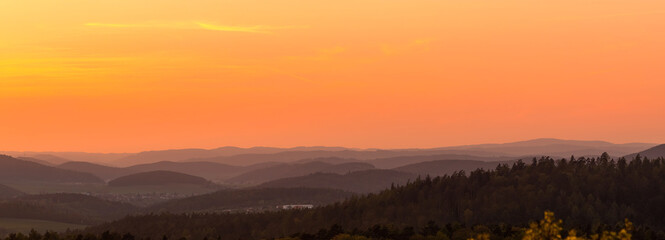 Fototapeta na wymiar Breathtaking panorama of sunset and landscape.
