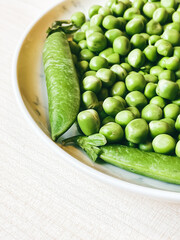 Harvest organic vegetables green peas.