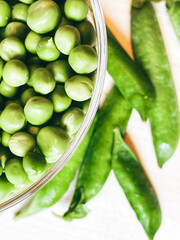 Harvest organic vegetables green peas.