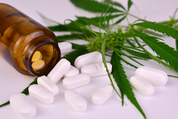 Cannabis pills and leaves. Cannabis based medicine concept.
