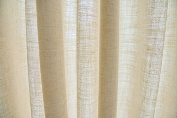 Light beige sand linen natural curtains on window, close-up