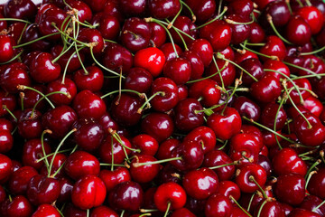 Delicious red cherries on a market stall