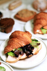 food, croissant, breakfast, bun, sandwich, bread, snack, french, meal, pastry, lettuce, lunch, cheese, delicious, fresh, white, meat, bakery, dinner, homemade, fast, ham, slice, background, table, woo