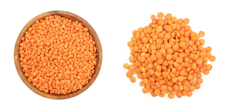 red lentil in wooden bowl isolated on white background. Top view