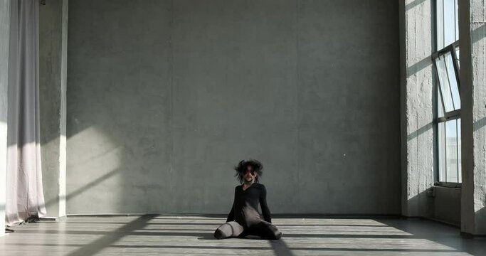 Professional Caucasian dancer as he fearlessly redefines boundaries in high heels at an innovative dance studio. His fearless experimentation, combined with the finesse of high heels.