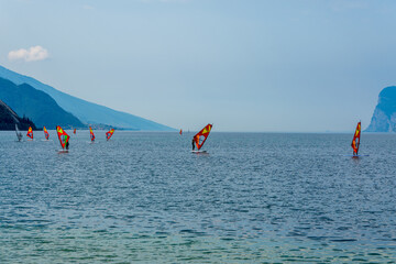 Windsurfers on Lake Garda near Torbole in Italy.