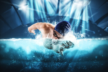 Sporty man athlete swims with energy during a competition in the pool