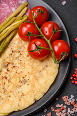 Delicious nutritious breakfast consisting of asparagus, scrambled eggs, salt, spices and herbs