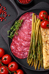 Delicious nutritious breakfast consisting of asparagus, scrambled eggs, salt, spices and herbs