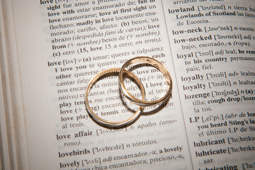 Word LOVE next to rings