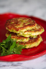 fried zucchini fritters with herbs.
