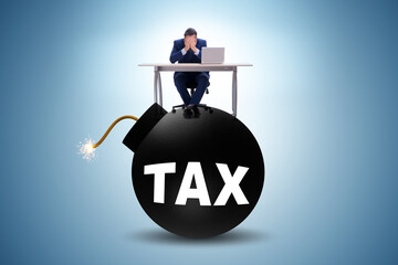 Tax concept with exploding bomb