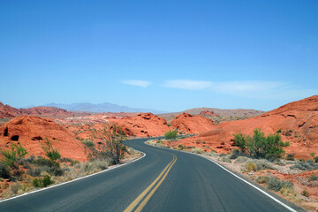 Fototapeta na wymiar Winding road in red colorful desert mountain in southwest USA