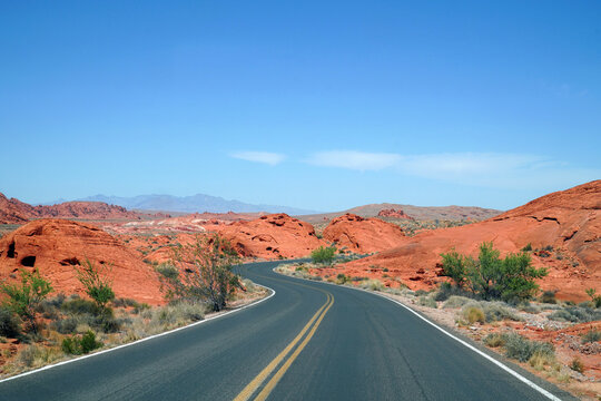 Winding road in red colorful desert mountain in southwest USA - Powered by Adobe