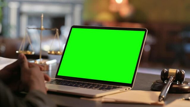 Close up of Judge with Laptop with Green Screen in Court