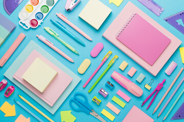 Flat lay with colorful school stationery on color backgroung, top view
