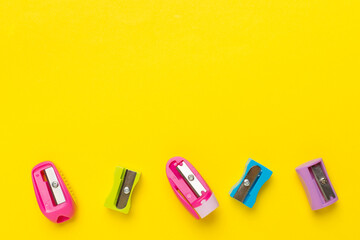 Different sharpeners on color backgroung, top view