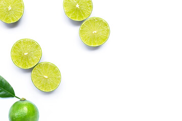 Limes with leaves isolated on white.