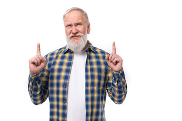 Naklejka premium mature gray-haired retired man with a mustache and beard shows with his hands for the presence of a strategy on a white background