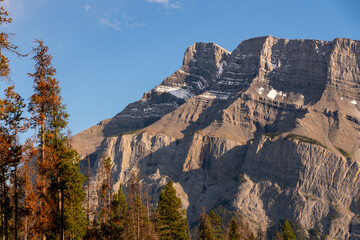 Sunset sky over Mount Rundle in Banff National Park during summer time with long daylight hours,...