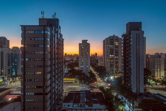 Sao Paulo City. Brazil. Sunset in Campo Belo and Brooklin district. Car traffic on Vereador Jos&eacute; Diniz avenue.