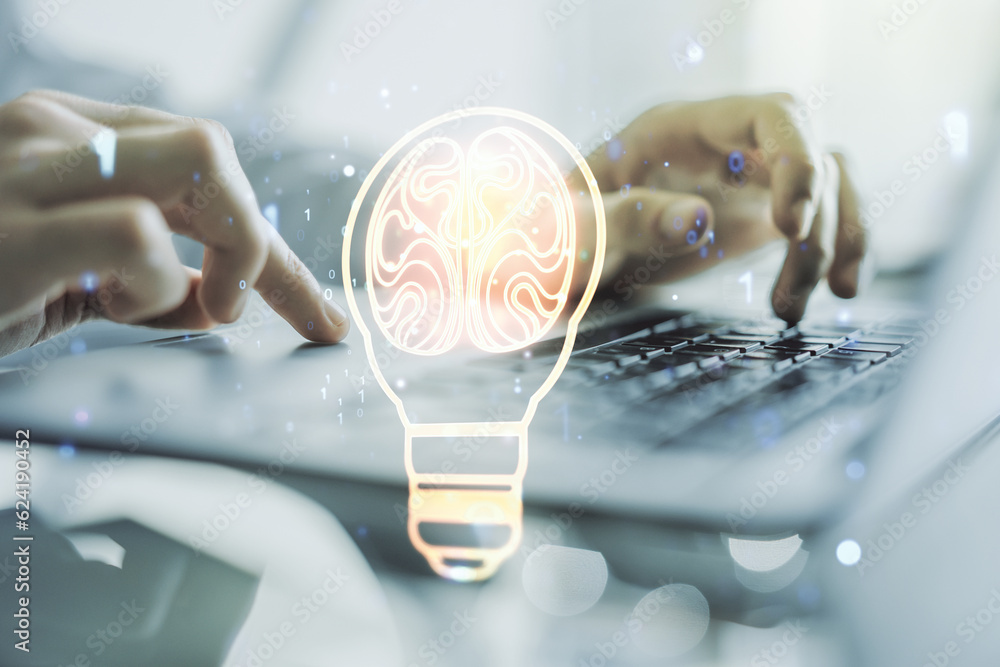 Aufkleber creative light bulb with human brain hologram and with hands typing on computer keyboard on backgrou