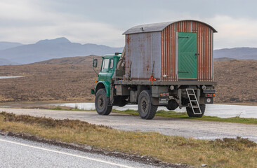 Old fashioned tin shed on the back of a truck