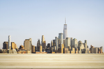 Blank wooden tabletop with beautiful New York skyline at daytime on background, mockup