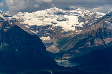 Iconic Lake Louise seen from a distance near the gondola with stunning mountain views surrounding...