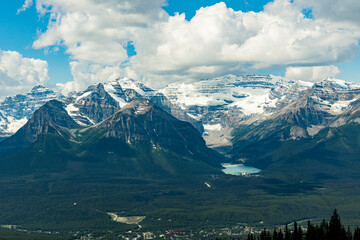 Iconic Lake Louise seen from a distance near the gondola with stunning mountain views surrounding the turquoise nature, national park area.  © Scalia Media