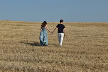 Couple walking in the field